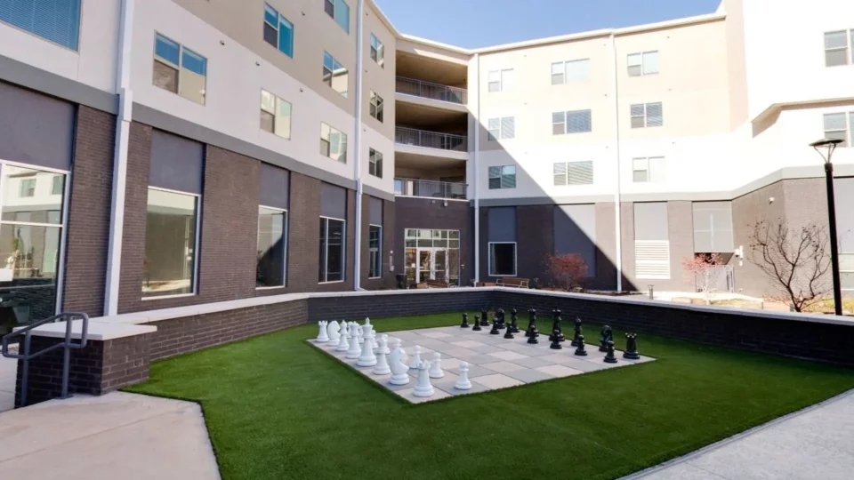 chess board in front of a building with a courtyard at The Argon