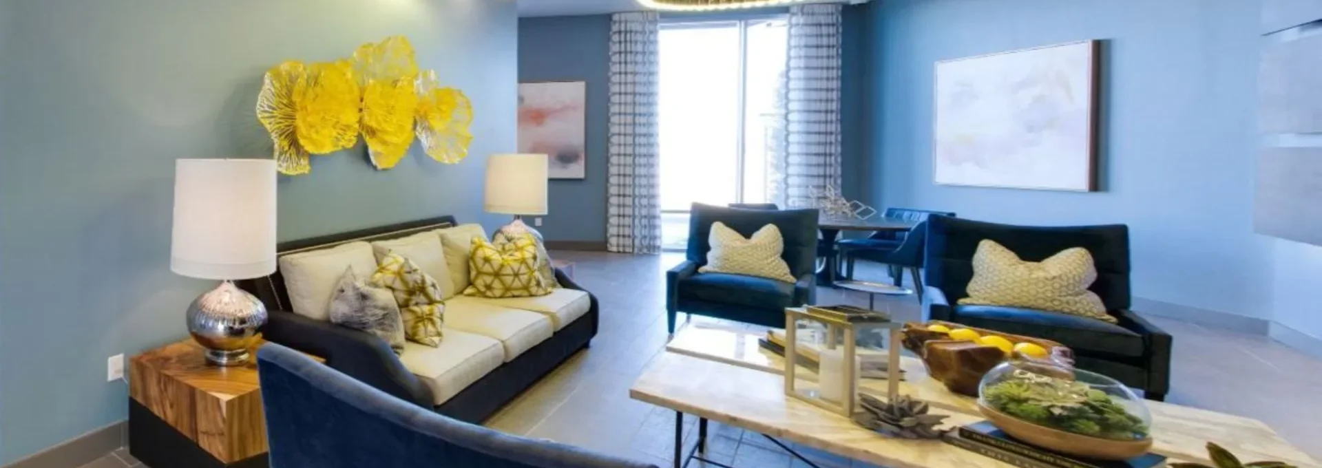 a living room with blue walls and a blue couch at The Argon