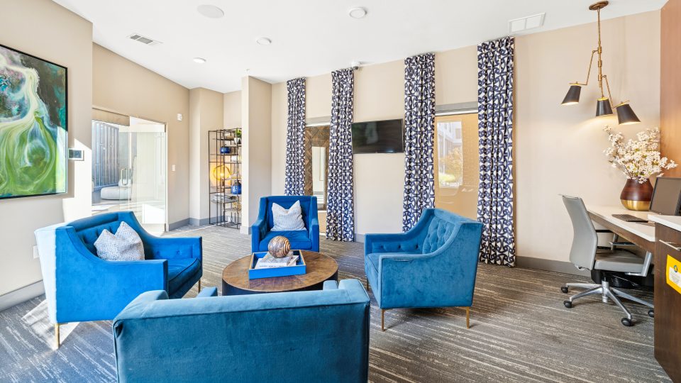 a living room filled with furniture and a tv