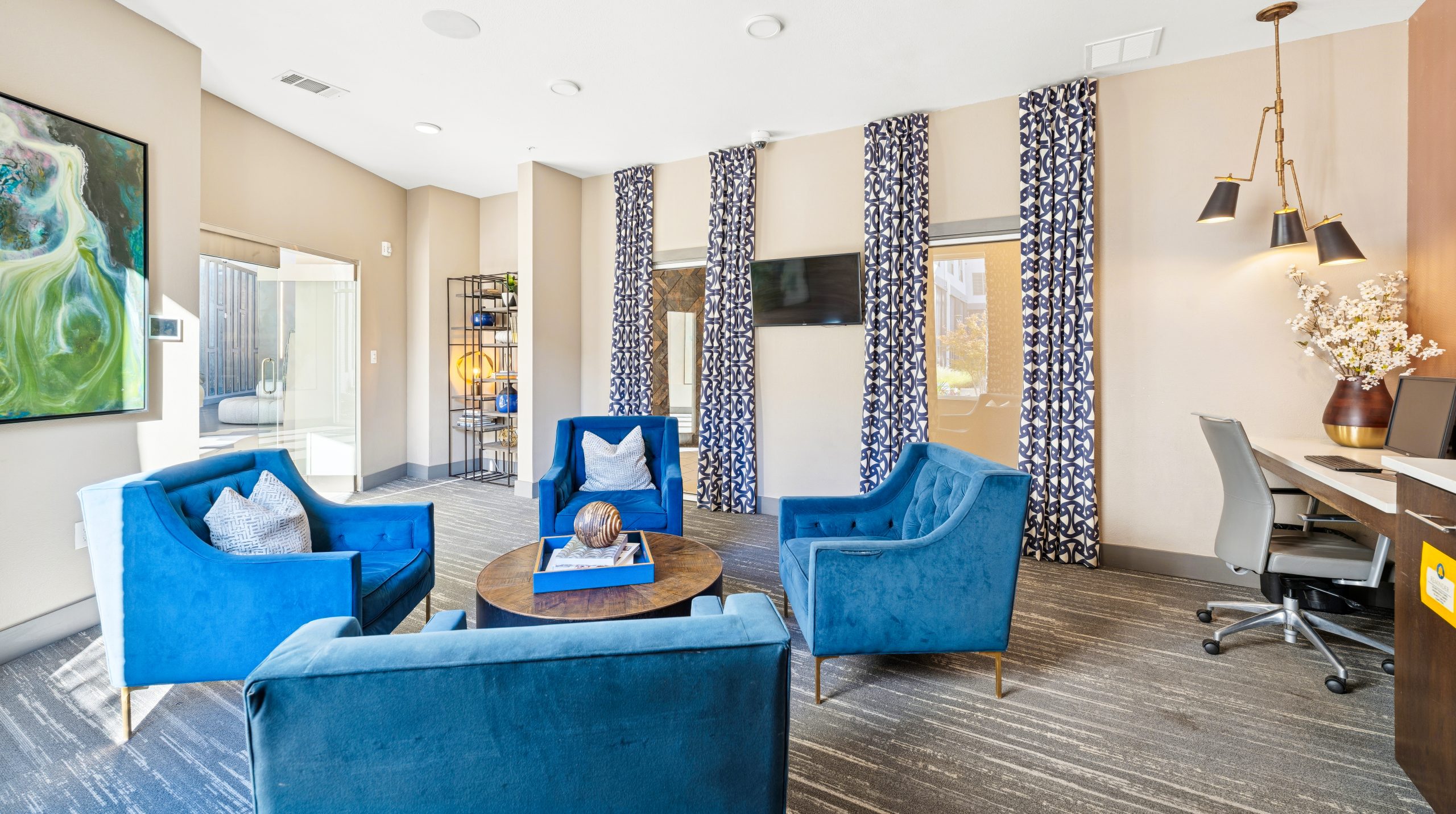 a living room filled with furniture and a tv