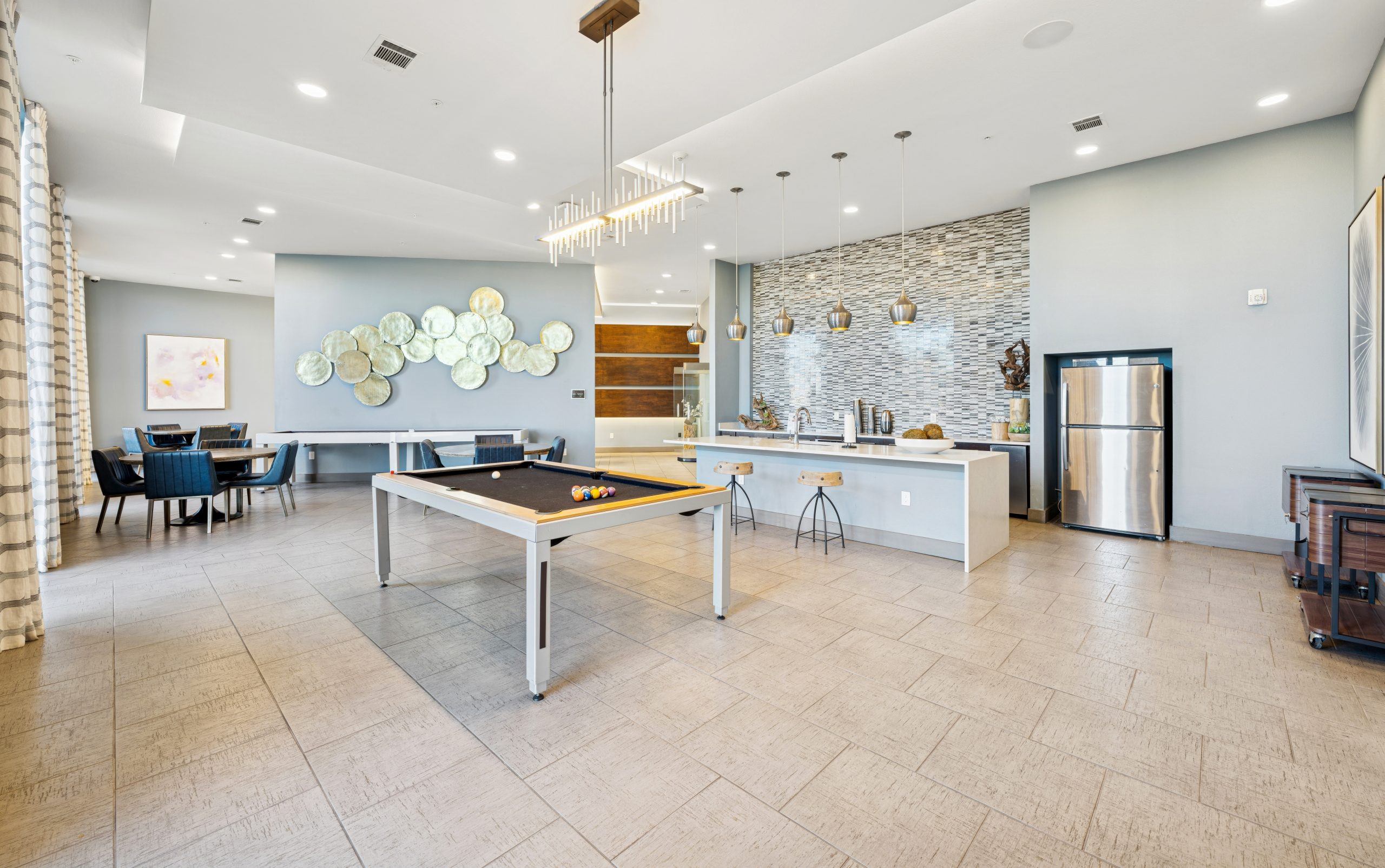 a kitchen with a table and chairs in it