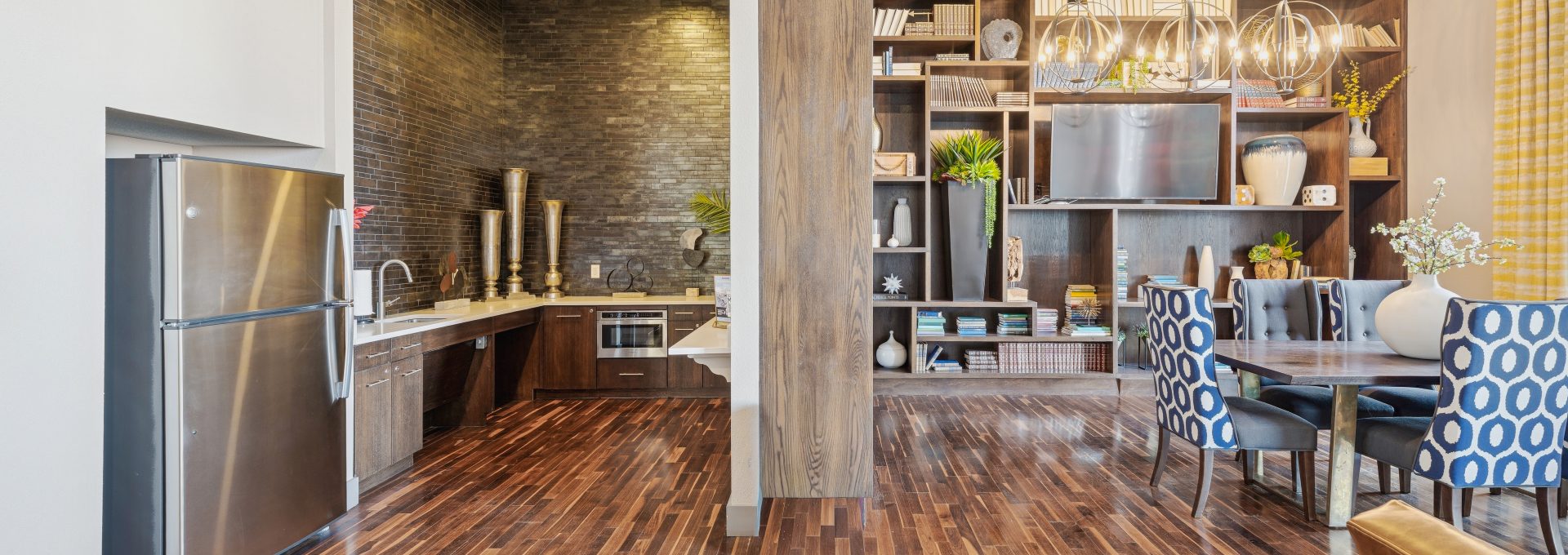 a kitchen with wooden floors and wooden cabinets