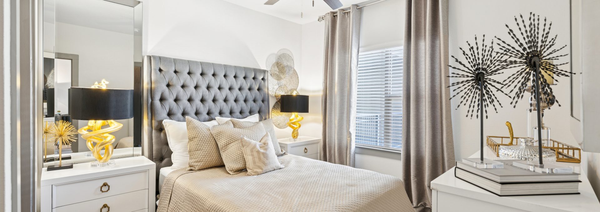 a bedroom with a large bed and a large window