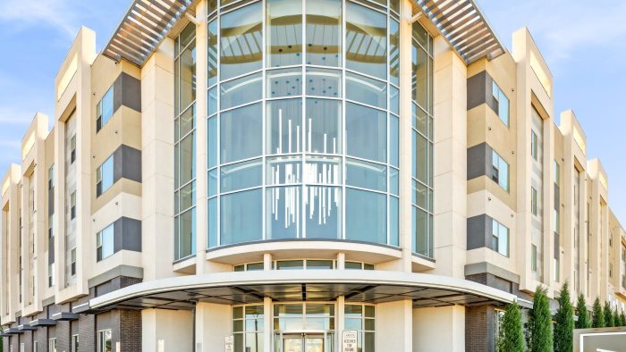 Exterior view of a building with parking spots in front